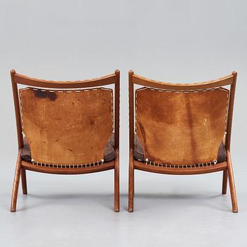 Fredrik Kayser, Rastad & Relling Tegnekontor, a pair of teak and leather "The Cross Chair", produced by Gustav Bahus, Norway 1950's.