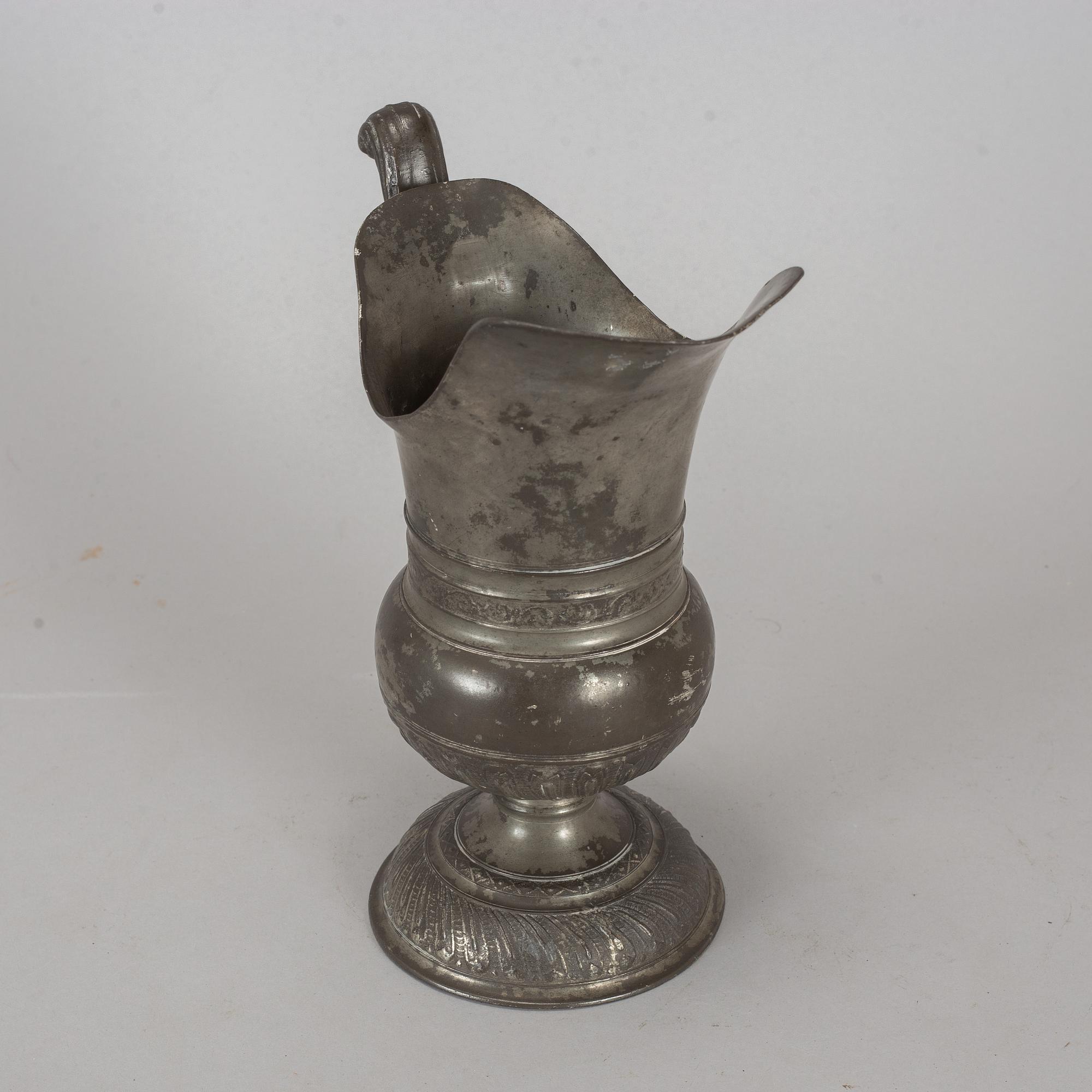 A pewter jug, probably 17th century.