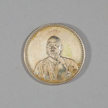 A box with five silver coins, Republic, early 20th Century.
