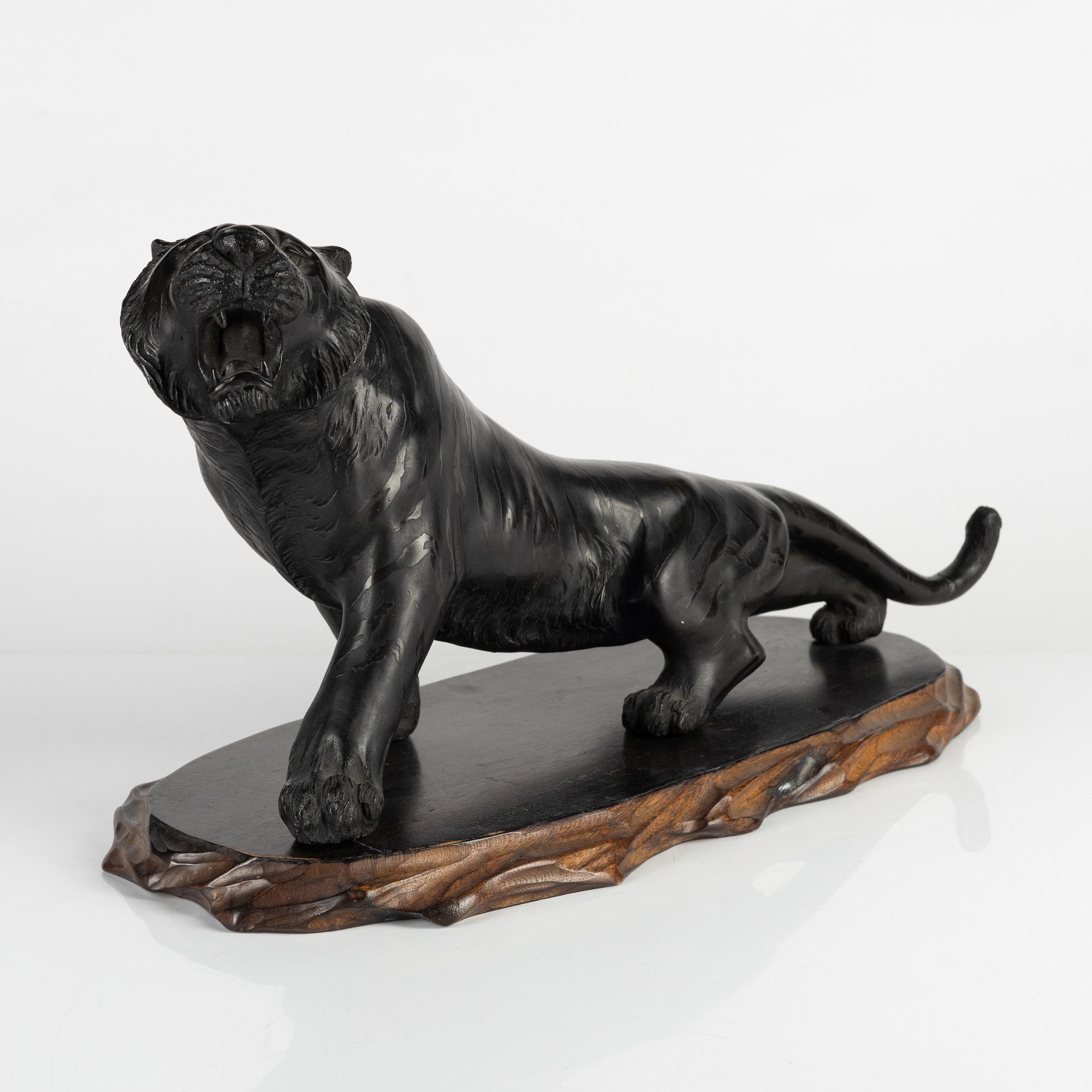 A Japanese bronze sculpture of a tiger, 20th Century.