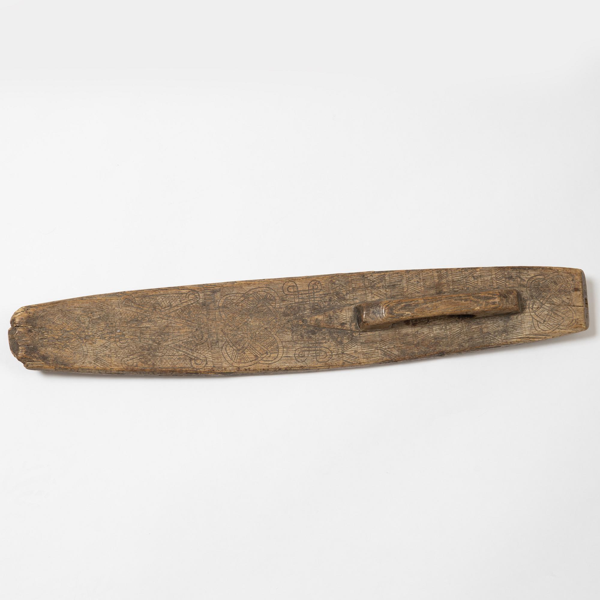 A Swedish folk art mangle board, dated 1666.