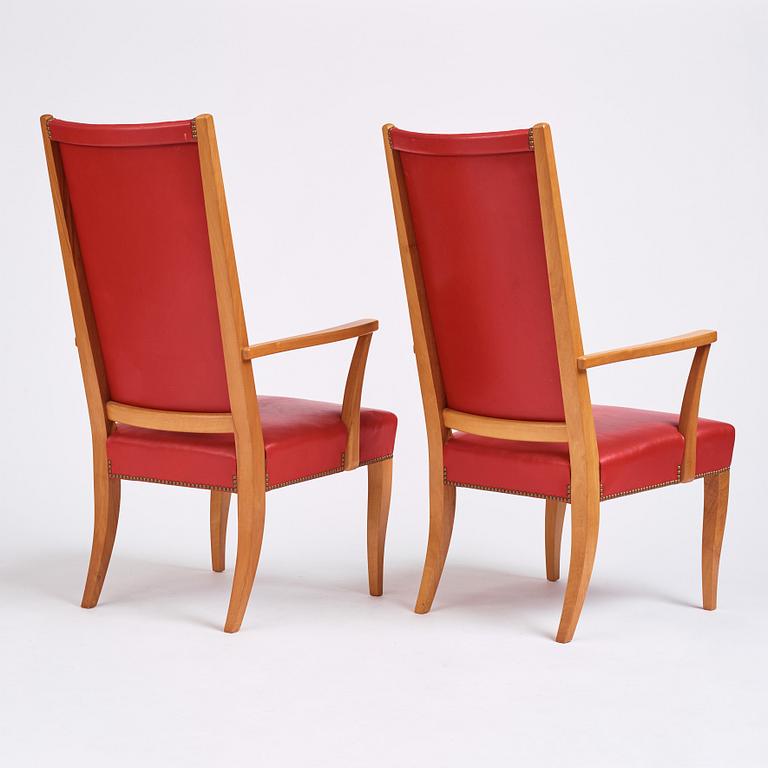 Josef Frank, a pair of walnut and red leather easy chairs, Svenskt Tenn, Sweden 1940-60s.