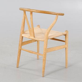 A 2007 "The Wishbone chair" by Hans J. Wegner, Carl Hansen & Søn.