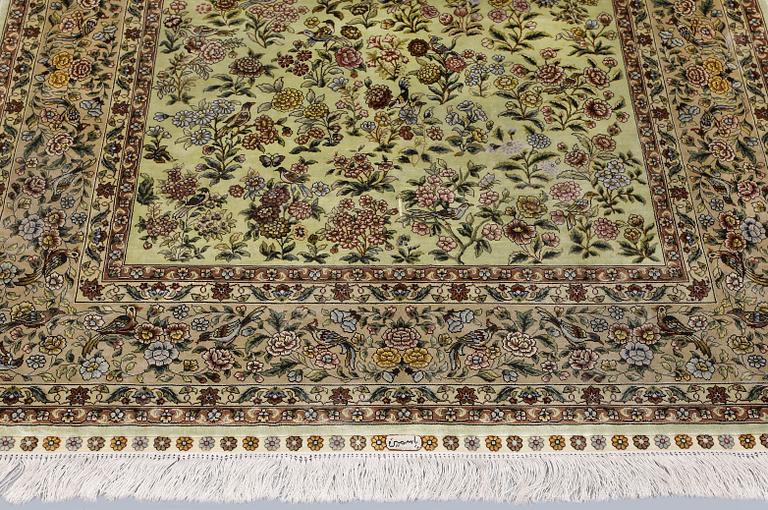 A oriental silk rug, 183 x 129 cm.
