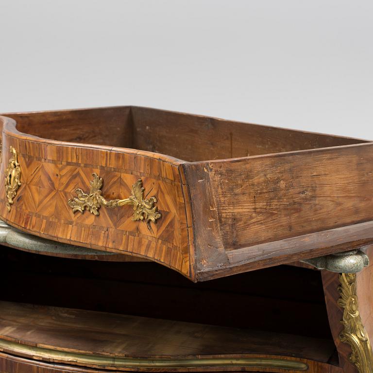 A 1700s rococo commode.