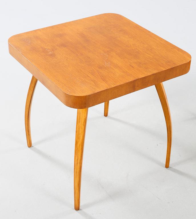A table and a arm chair from the second quarter of the 20th century.