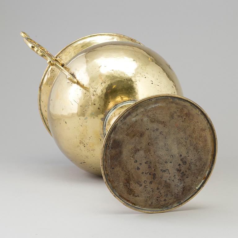 A 19th century brass champagne cooler.