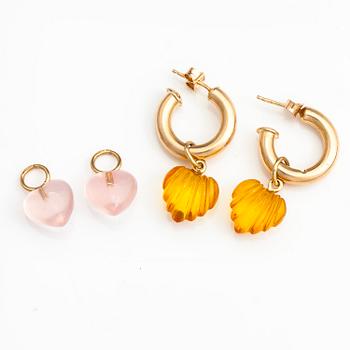 A pair of 14K gold earrings with rose quartz and plastic pendants.