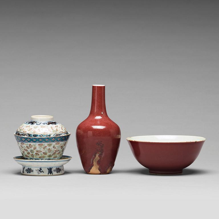 A sang de boef vase and bowl and an enamelled cup with cover and stand, Qing dynasty (1664-1912).