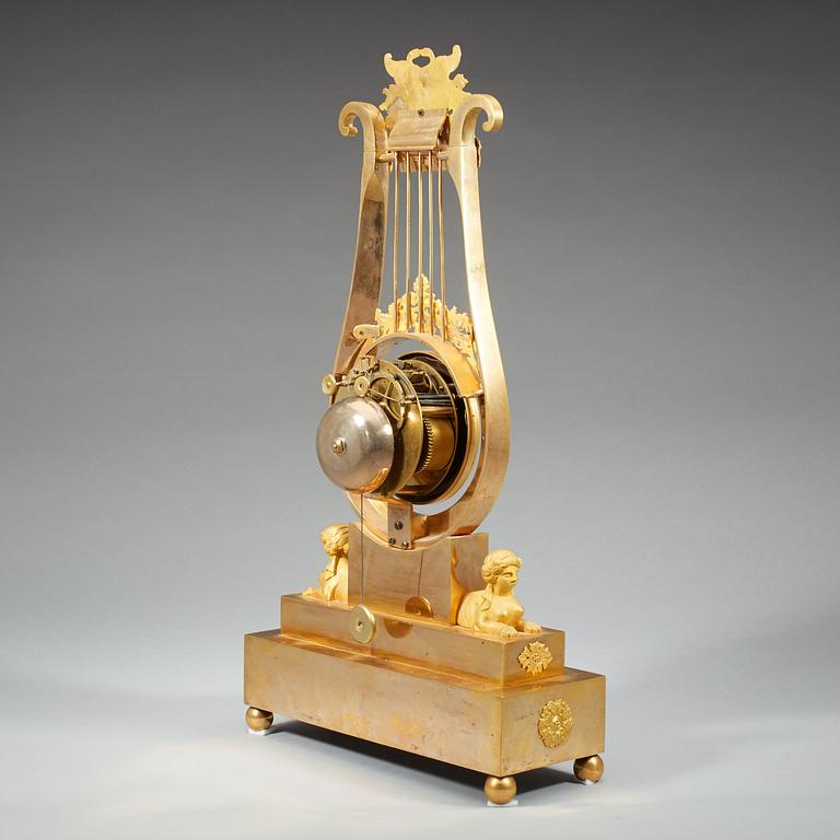 A late Gustavian early 19th century gilt bronze mantel clock.