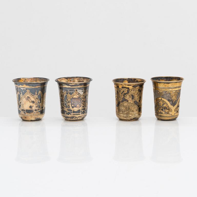 Four parcel-gilt silver beakers, Moscow 1870, 1876 and 1890.