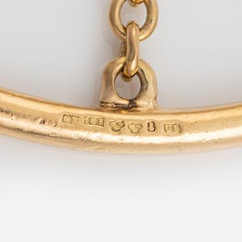 An 18K gold bracelet.