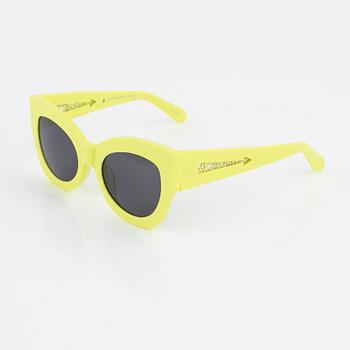 Karen Walker, a pair of neon green "Northern lights" sunglasses.