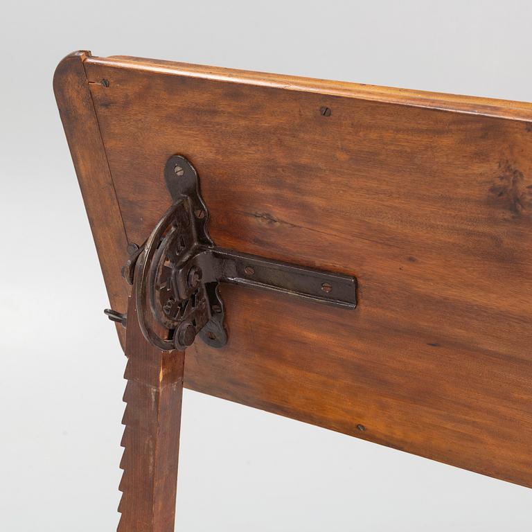 A reading table, J. Carter London, England, circa 1900.