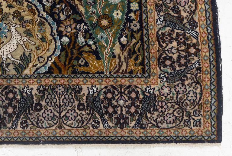 A figural Quum carpet, c. 179 x 125 cm.