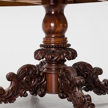 A mid 19th century mahogny table.