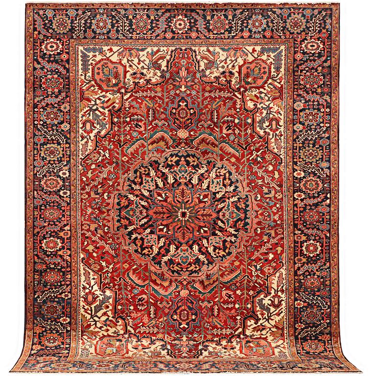A carpet, semi-antique Heris, approx. 360 x 260 cm.