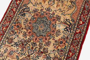 A semi-antique Isfahan rug, central Iran, part silk, signed (Mohammed) Seirafian, c. 120 x 70 cm.