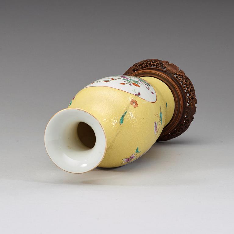 A famille rose and yellow sgraffitto vase, late Qing dynasty / early Republic with Qianlong sealmark.