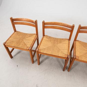 A set of four 1970s pine chairs.