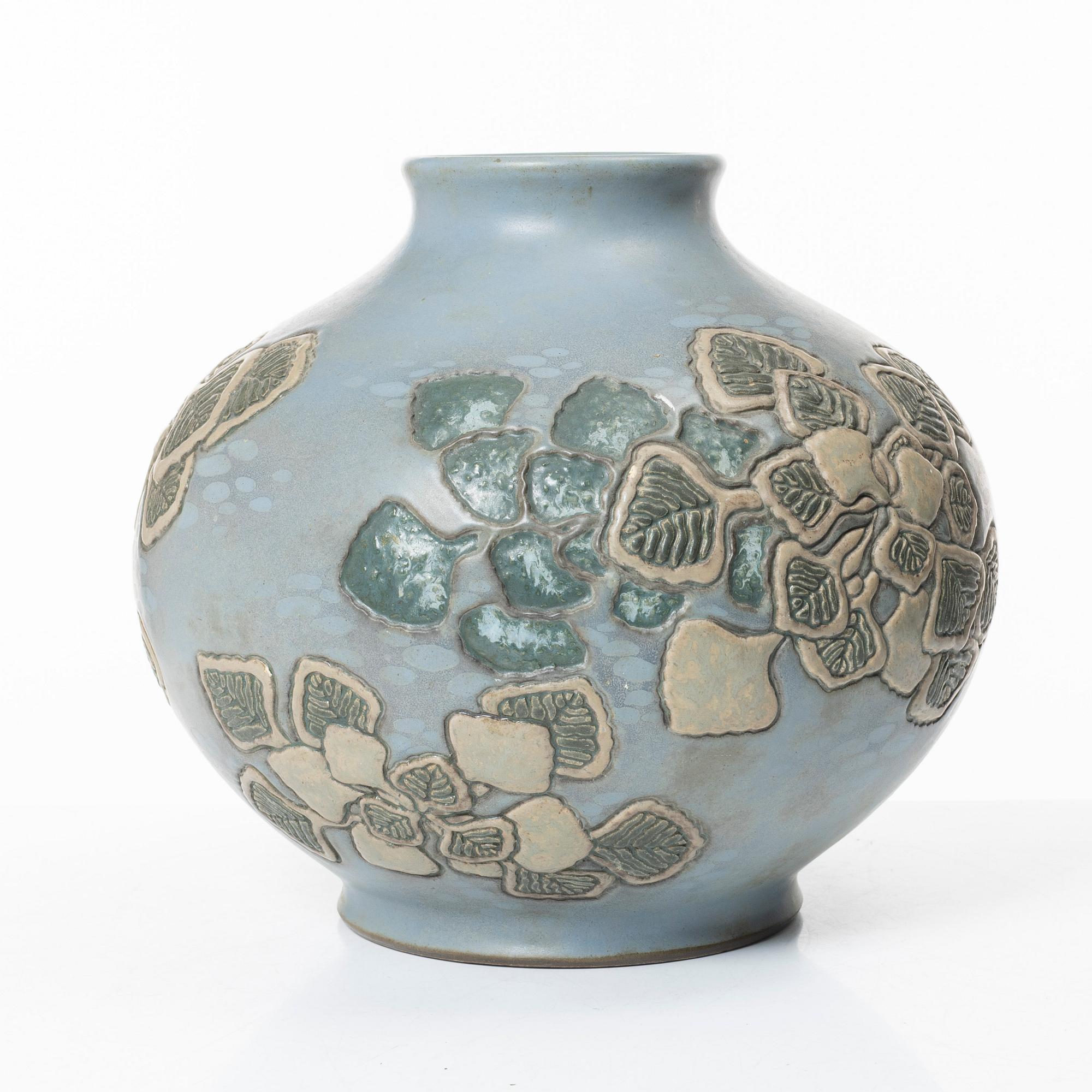 A blue glazed relief vase, possibly Korea, around 1900.