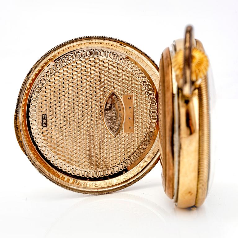 A mid 1800s gilded bronze pocket watch stand and pocket watch.