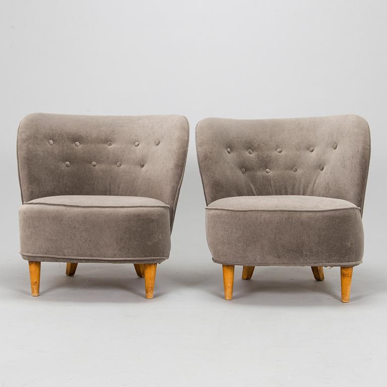 A pair of mid 20th century armchairs.