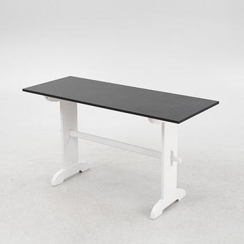 A painted table, 20th Century.