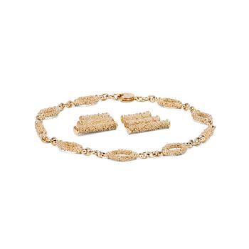 YVES SAINT LAURENT, a gold colored necklace with a pair of earclips.