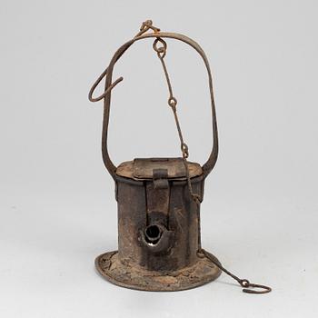 A 19th century tinplate oil lamp.