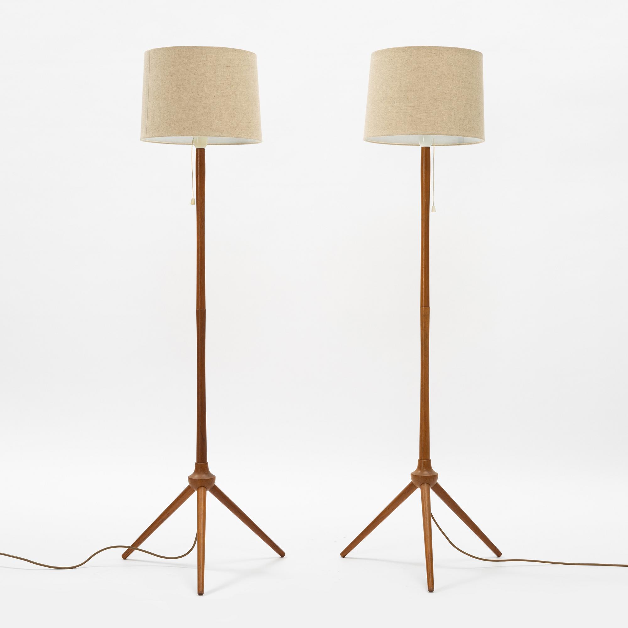 A pair of teak floor lamps, mid 20th century.