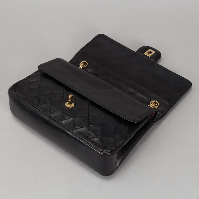 CHANEL, a quilted black leather 'Double Flap Bag'.