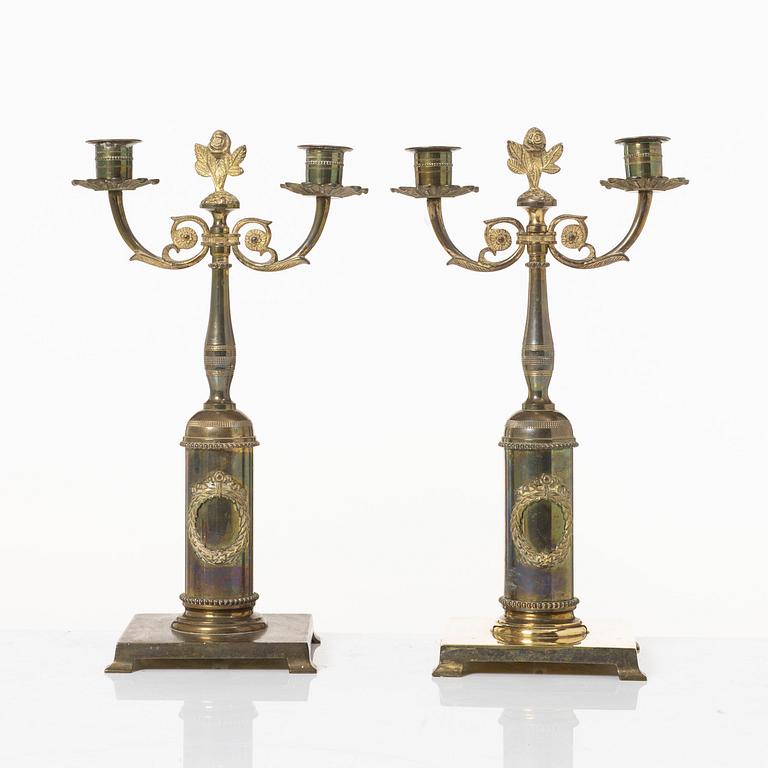 Candle holders, a pair of brass, Empire style, 20th century.