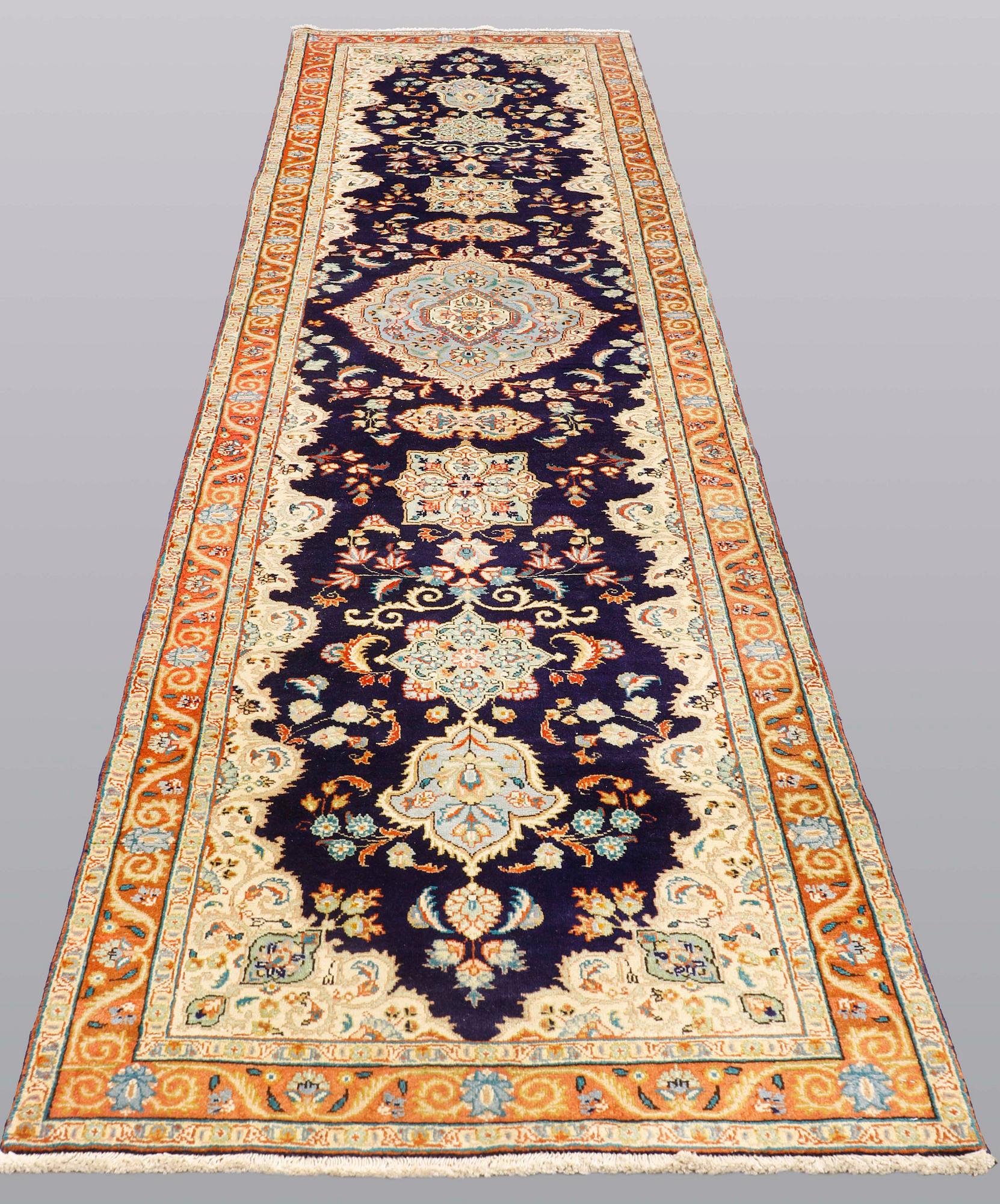 A Tabriz runner, so called Tabatabai, ca 402 x 97 cm.