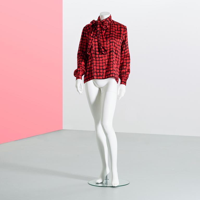 KNYTBLUS, Yves Saint Laurent.