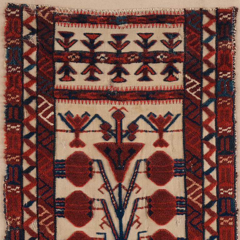 A TENT BAND, FRAGMENT, an antique Turkmen, Czar Russia, ca 102,5 x 39 cm. Framed (with the mounting 107x42 cm).