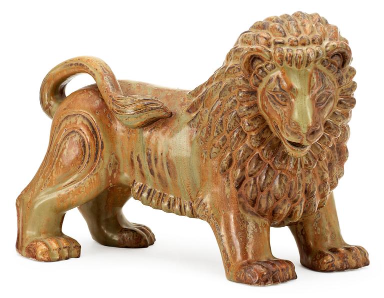 A Gunnar Nylund stoneware figure of a lion, Rörstrand.