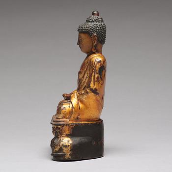 A seated bronze figure of buddha, Ming dynasty (1368-1644).