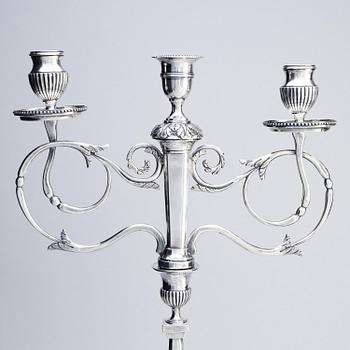 A pair of Swedish silver candelabras, marks of Pehr Zethelius, Stockholm 1797 and Daniel Hedberg, Eksjö 1829.