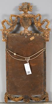 A mirror in gustavian style, made around year 1900.