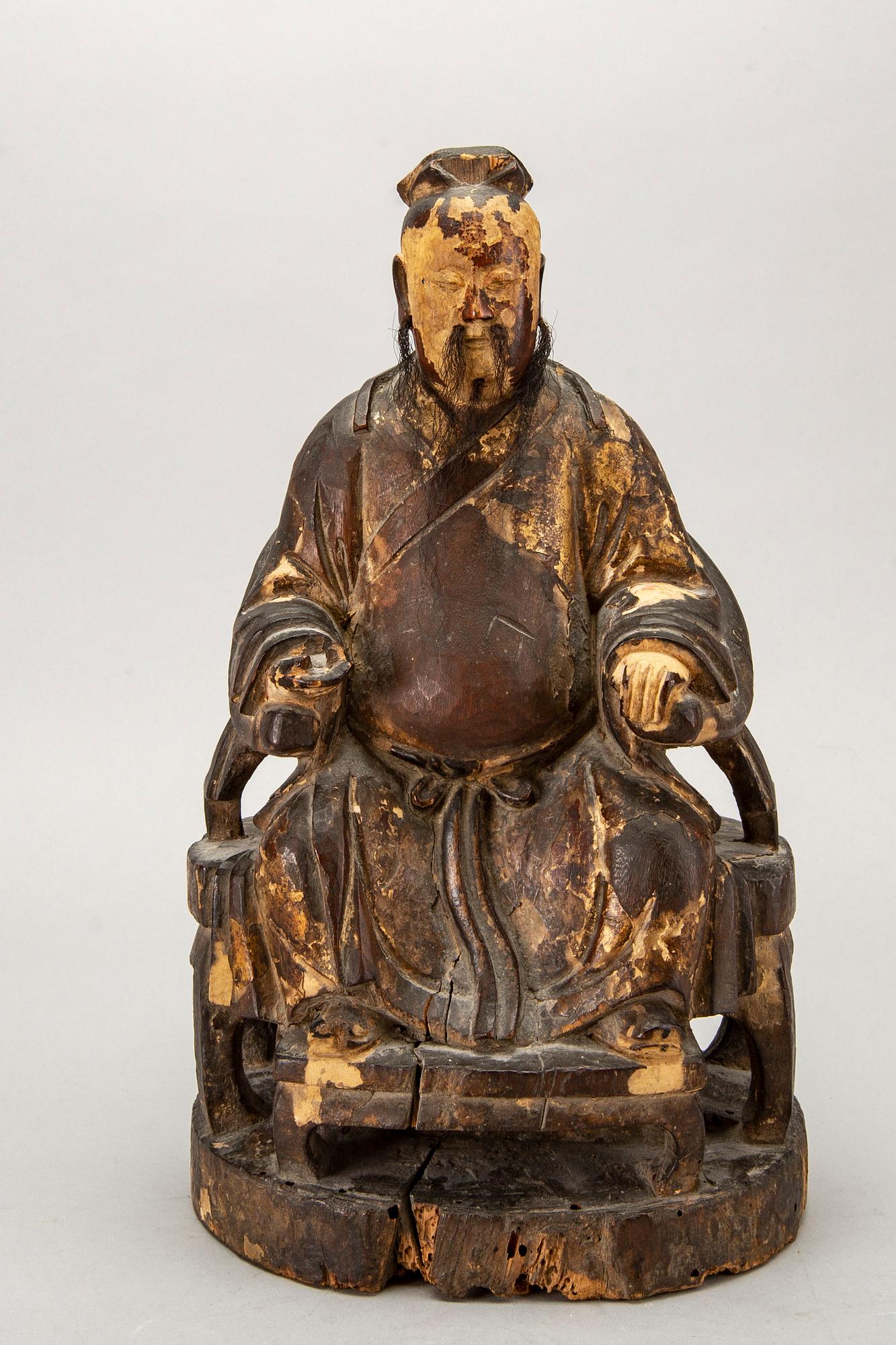 A Chinese late Qing painted wooden sculpture.