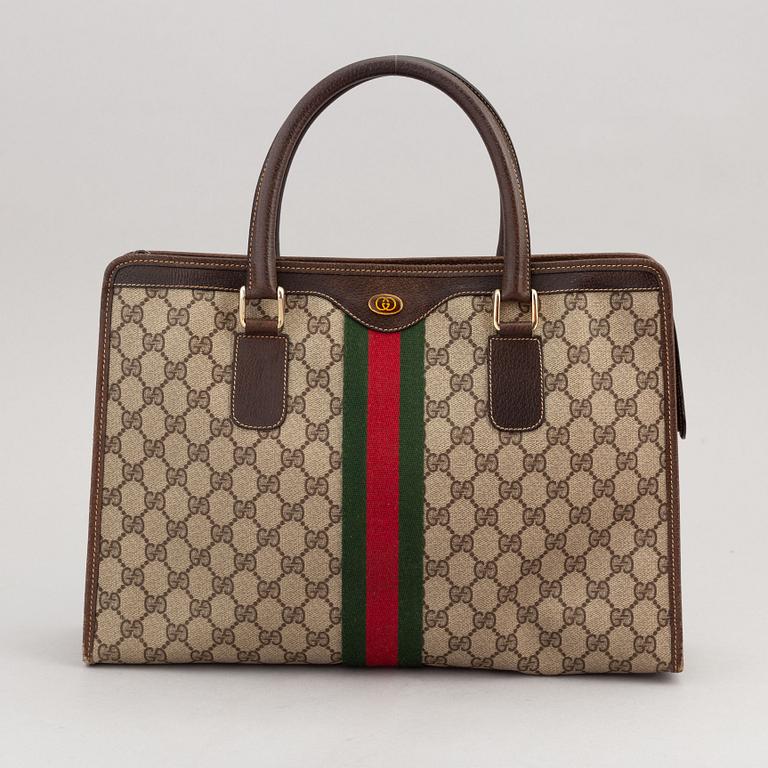 Gucci, a canvas handbag.