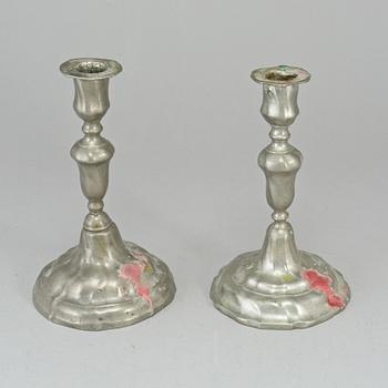 Two pewter rococo candlesticks.