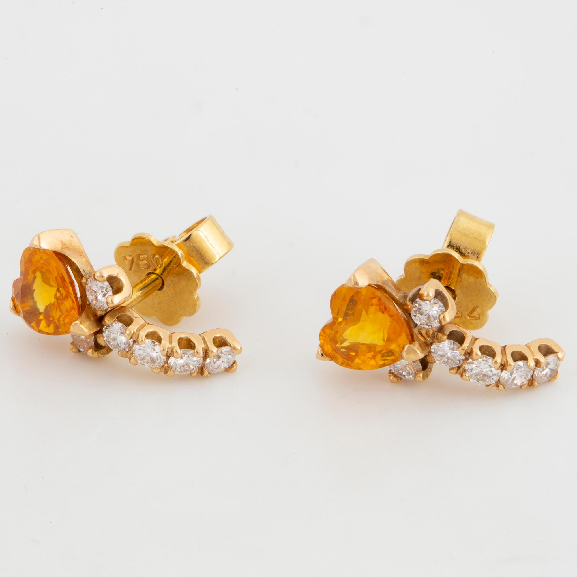A pair of heart shaped yellow sapphire and brilliant-cut diamond earrings.