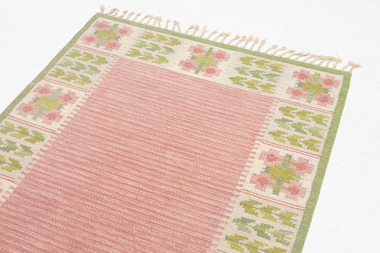 Berit Woelfer, a 'flora' flat weave rug, c. 203 x 136 cm, signed BW.