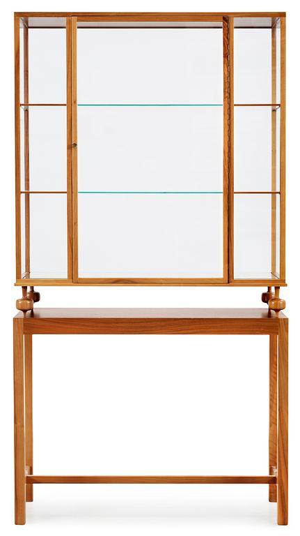 A Josef Frank walnut showcase cabinet, Svenskt Tenn, model 2077.