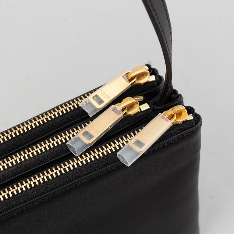 Céline, a black leather 'Trio Bag'.
