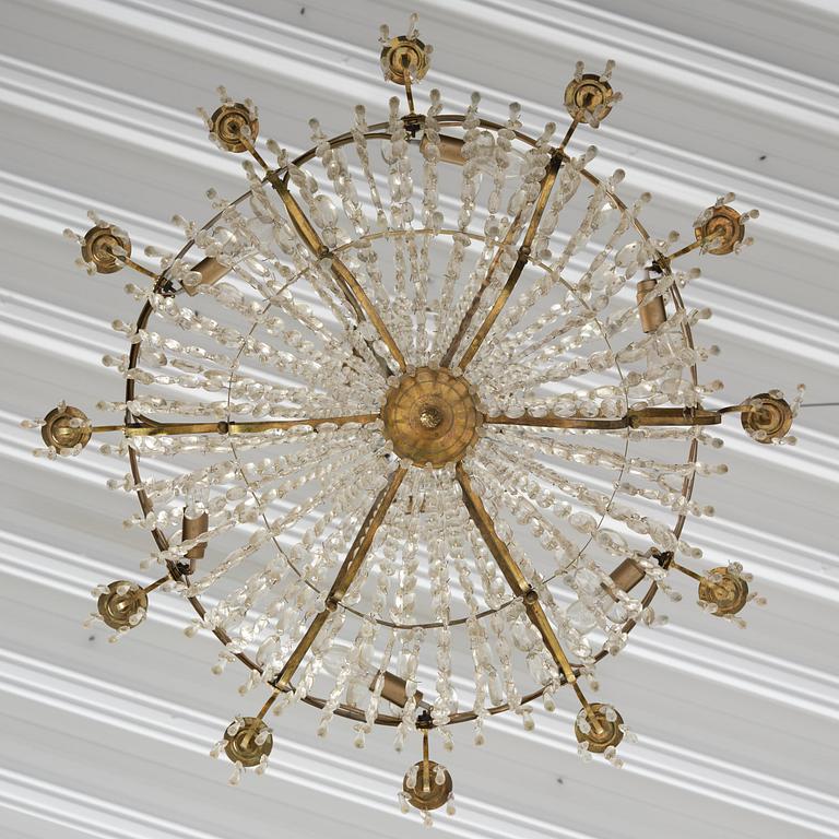 A Swedish gilt brass and cut glass thirteen-light Empire chandelier, early 19th century.