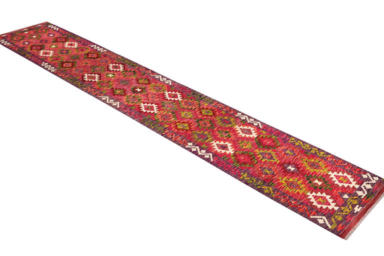 A Kilim runner carpet, c. 489 x 80 cm.