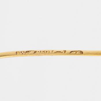 Brooch, 18K gold with cabochon-cut ruby, decoration of leaves.